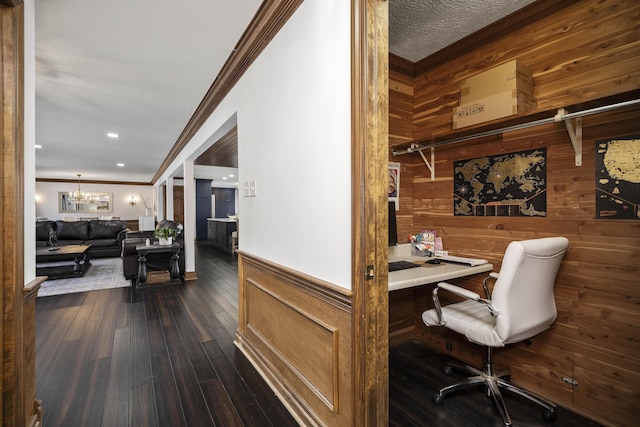 office area with dark hardwood / wood-style flooring, a notable chandelier, and ornamental molding