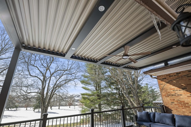 exterior space with ceiling fan and a balcony