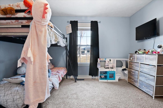 carpeted bedroom with a textured ceiling