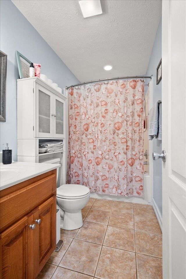 full bathroom with shower / tub combo with curtain, tile patterned flooring, vanity, a textured ceiling, and toilet