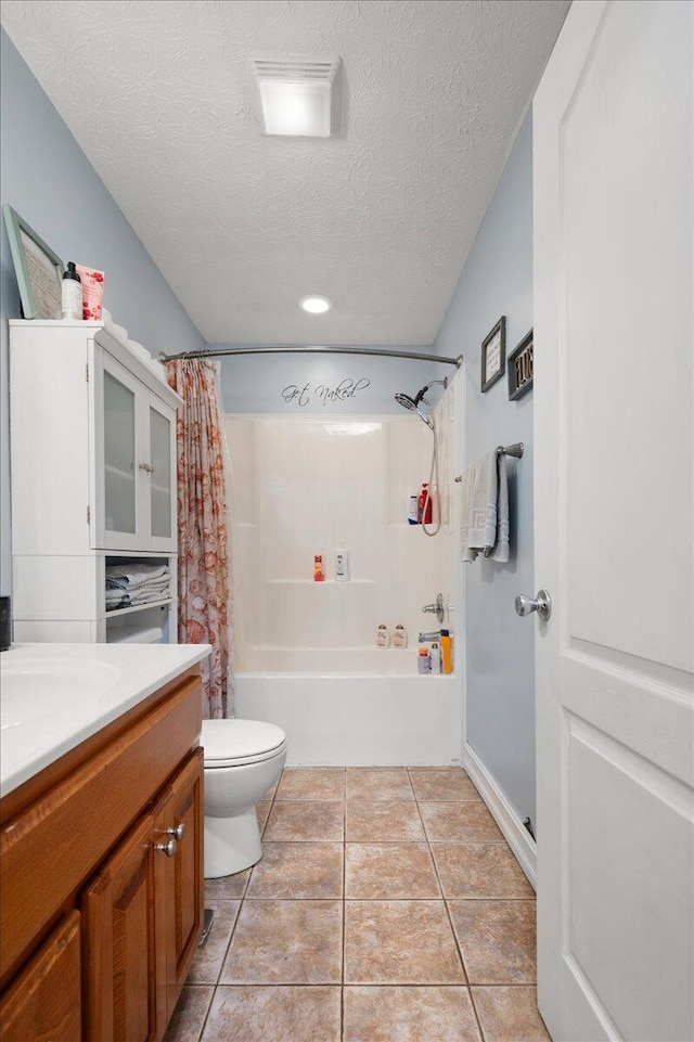 full bathroom featuring vanity, a textured ceiling, tile patterned floors, toilet, and shower / bath combo with shower curtain