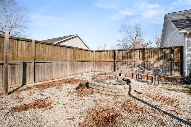 view of yard with an outdoor fire pit