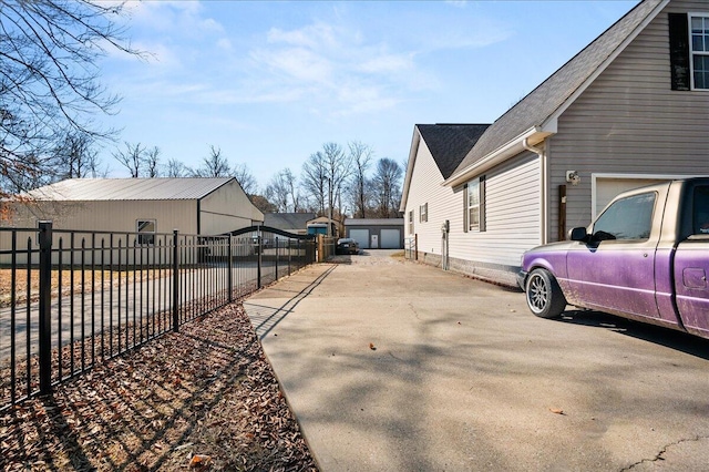 view of home's exterior with an outbuilding and a garage