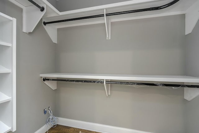 walk in closet featuring dark hardwood / wood-style flooring