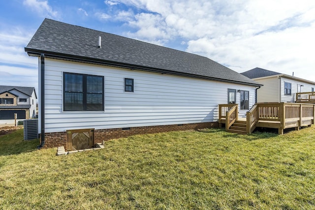 rear view of house featuring a yard, cooling unit, and a wooden deck