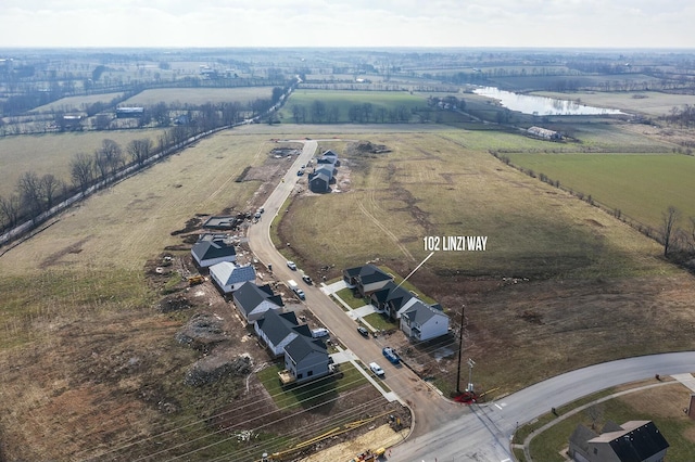 aerial view featuring a rural view and a water view