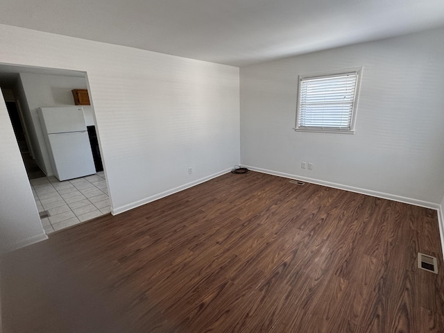 empty room with light hardwood / wood-style floors