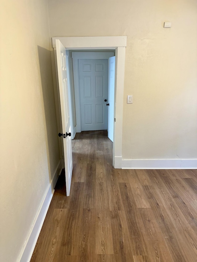 hallway featuring dark wood-type flooring