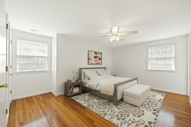 bedroom featuring hardwood / wood-style flooring and ceiling fan