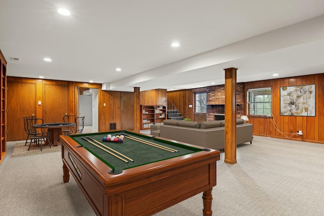 playroom featuring light colored carpet, a fireplace, wooden walls, and billiards