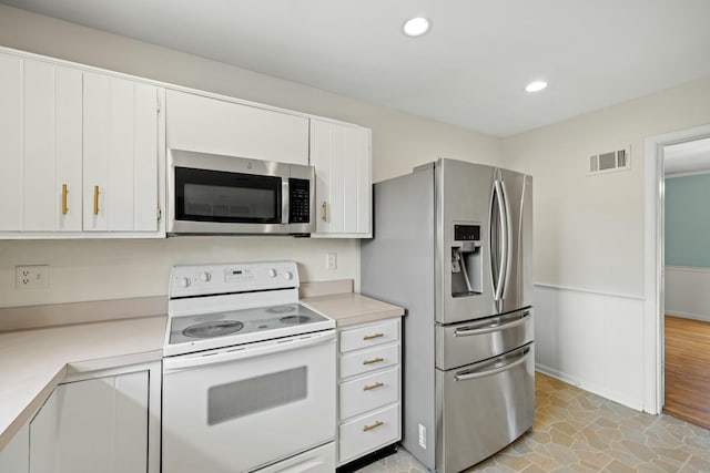 kitchen with white cabinetry and stainless steel appliances