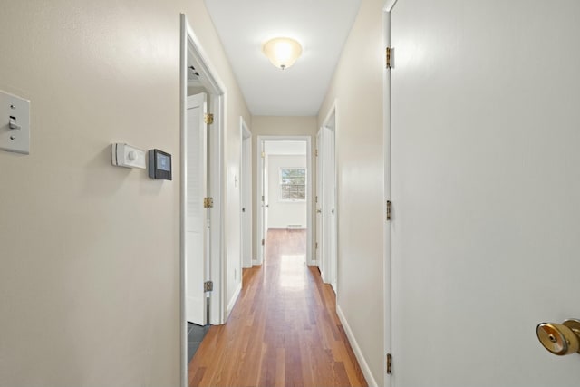 corridor featuring hardwood / wood-style flooring