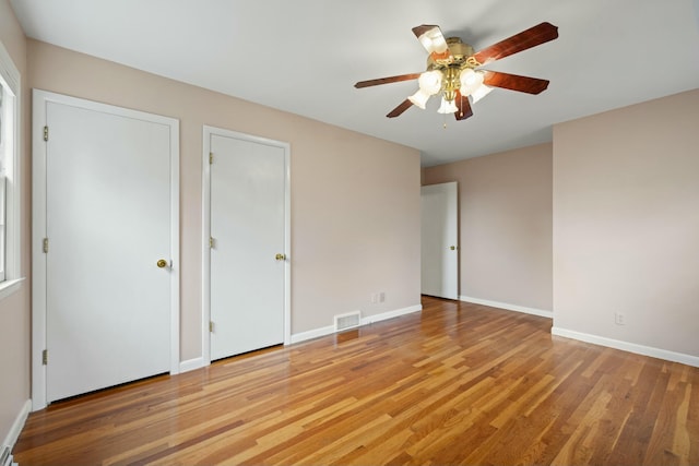 unfurnished bedroom featuring ceiling fan and light hardwood / wood-style flooring