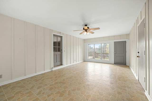 unfurnished room with ceiling fan