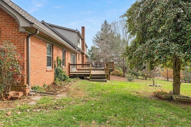 view of yard with a wooden deck