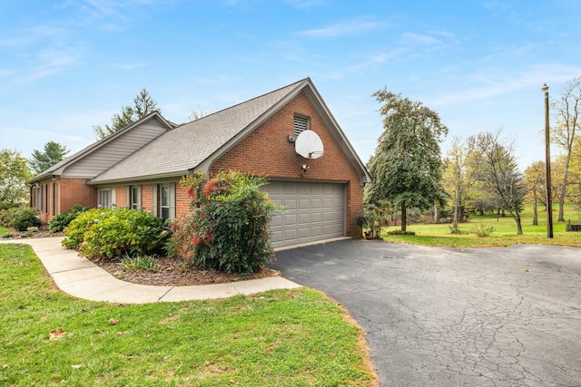 view of property exterior featuring a garage and a lawn