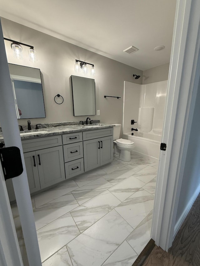 full bathroom featuring vanity, shower / tub combination, and toilet