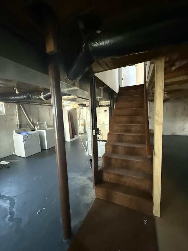 basement with separate washer and dryer and water heater