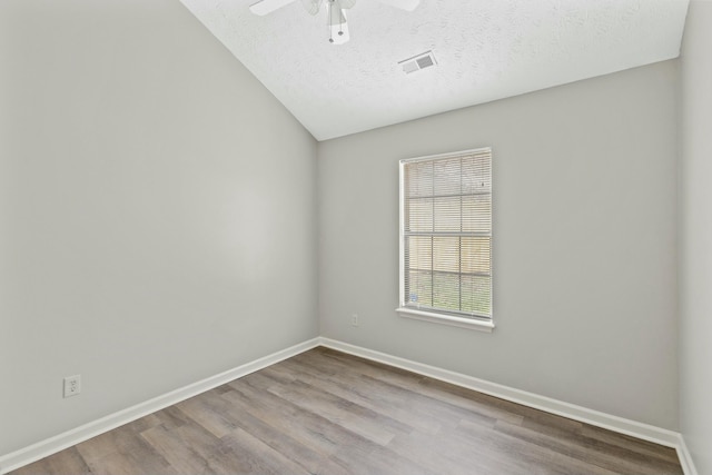 unfurnished room featuring ceiling fan, a textured ceiling, and light wood-type flooring