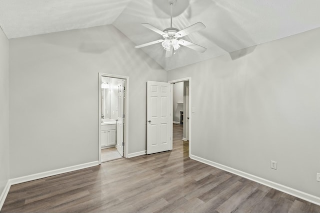 unfurnished bedroom featuring ceiling fan, connected bathroom, high vaulted ceiling, and light hardwood / wood-style flooring