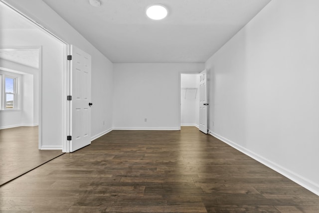 spare room featuring dark hardwood / wood-style flooring