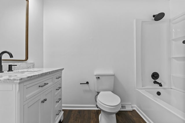 full bathroom featuring vanity, toilet, hardwood / wood-style floors, and shower / bathing tub combination