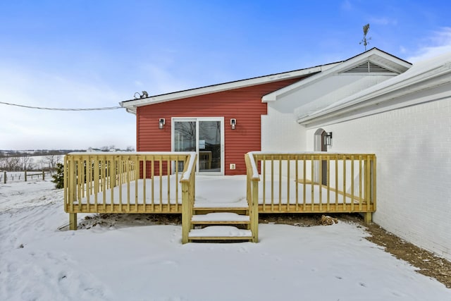 view of snow covered deck