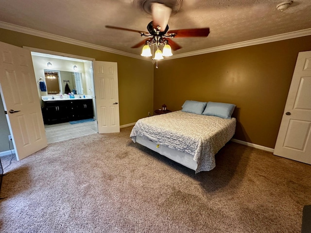 bedroom with ensuite bathroom, crown molding, a textured ceiling, carpet flooring, and ceiling fan