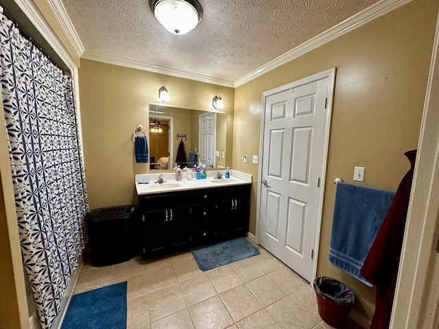 bathroom with ornamental molding, tile patterned flooring, and a textured ceiling