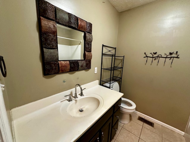 bathroom featuring tile patterned floors, toilet, a textured ceiling, vanity, and curtained shower