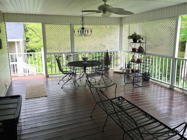 sunroom featuring ceiling fan