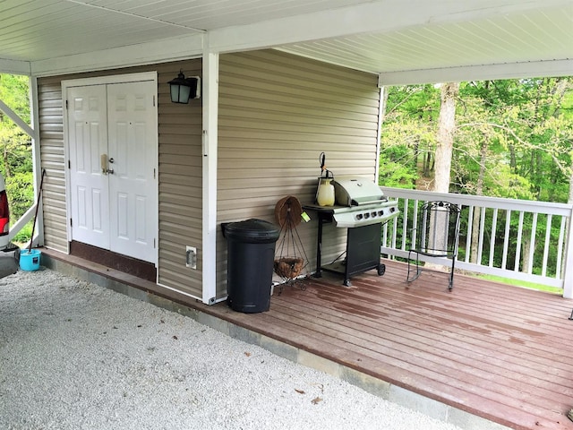 wooden deck with grilling area