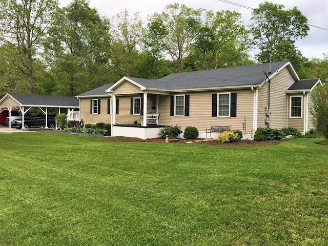 ranch-style house featuring a carport, covered porch, and a front yard