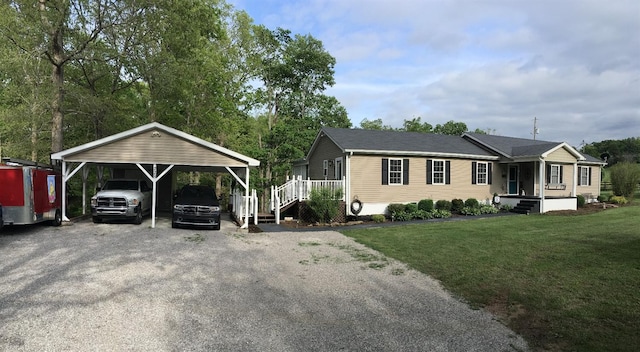 view of front of house featuring a carport and a front lawn