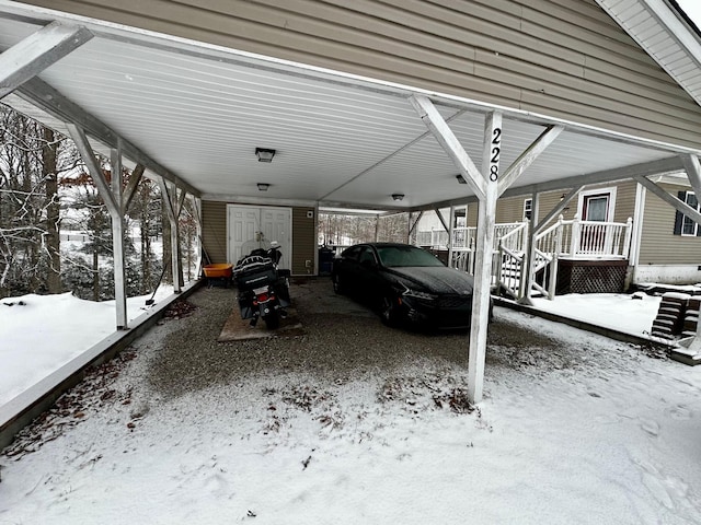 view of snow covered parking