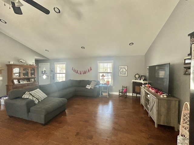 living room featuring dark wood-type flooring, vaulted ceiling, and ceiling fan