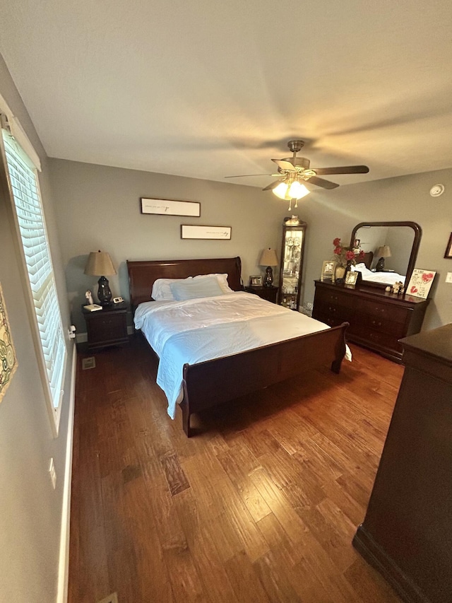 bedroom with ceiling fan and hardwood / wood-style floors