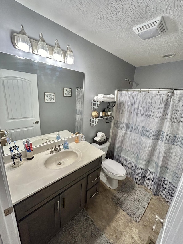 bathroom featuring a shower with curtain, vanity, a textured ceiling, and toilet