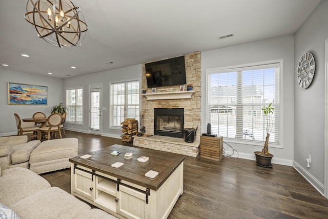 living room featuring a fireplace and dark hardwood / wood-style flooring