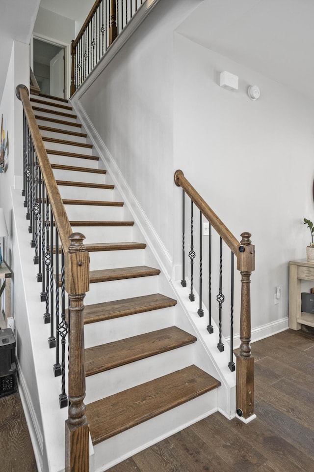 staircase featuring hardwood / wood-style flooring