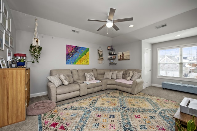 living room with ceiling fan and carpet flooring