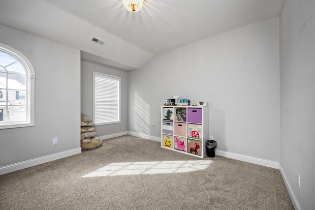 game room featuring carpet floors, plenty of natural light, and vaulted ceiling