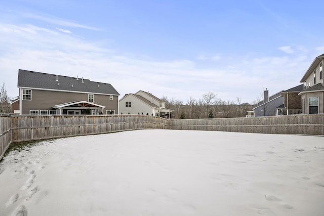 view of yard layered in snow