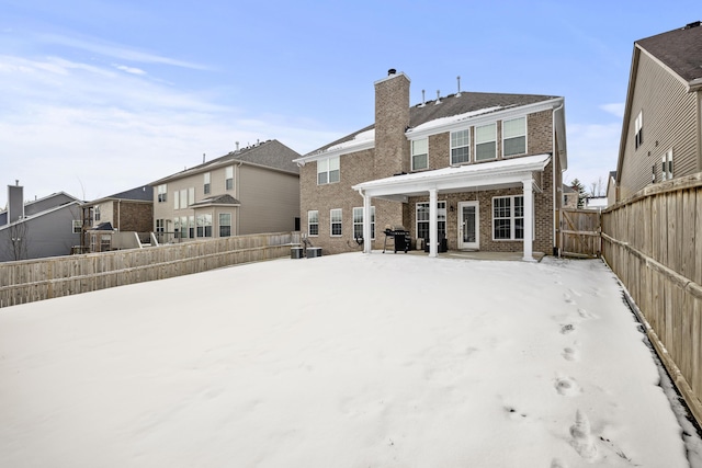 view of snow covered house