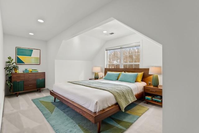 bedroom featuring lofted ceiling and light carpet