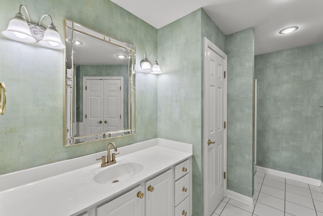 bathroom with walk in shower, tile patterned floors, and vanity