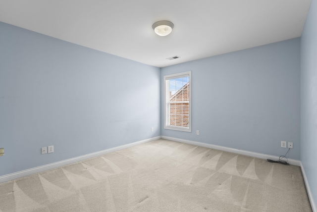 empty room with light colored carpet