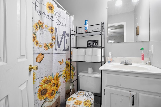 bathroom with vanity and toilet