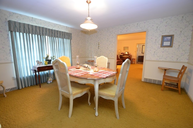 dining space with light carpet