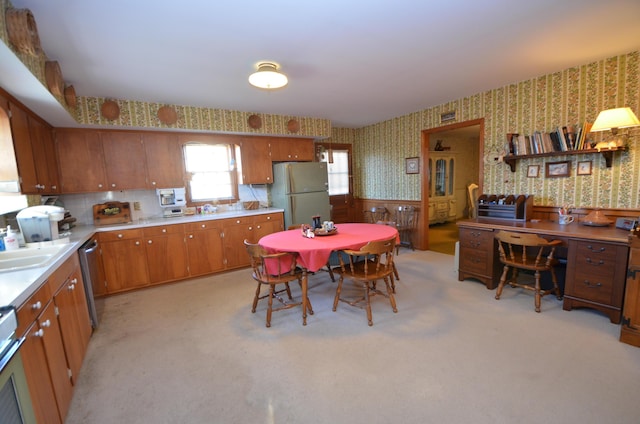 kitchen with light carpet, stainless steel dishwasher, refrigerator, and decorative backsplash